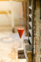 pendulum with plum for finding vertical line