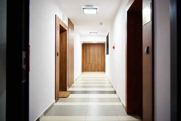 Hotel corridor with living room doors. Modern residential complex