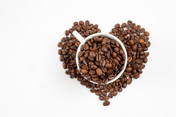 Coffee cup and heart-shaped coffee beans