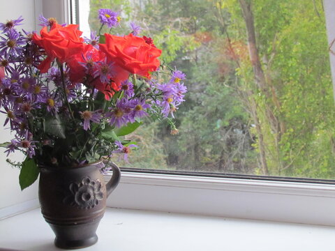 Red Roses And Autumn Blue Flowers In Vase