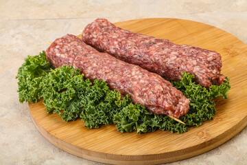 Raw minced beef kebab skewer