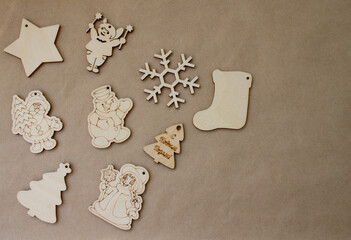 wooden toys, snowflake, Christmas trees, asterisk. brown background