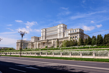 Fototapeta na wymiar The Palace of the Parliament also known as People's House (Casa Popoprului) in Constitutiei Square (Piata Constitutiei) in Bucharest, Romania, in a sunny spring day.