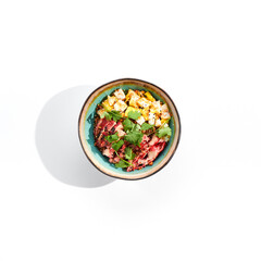 Chinese traditional dish - fried rice with vegetables, shredded omelette and chicken. Pan asian wok with rice and egg on white background. Nasi goreng with chicken on isolated background with shadows.