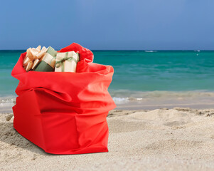 Santa Claus bag with gifts at sea resort