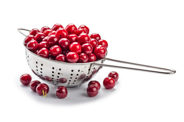 Fresh cherries in the colander isolated on white background.