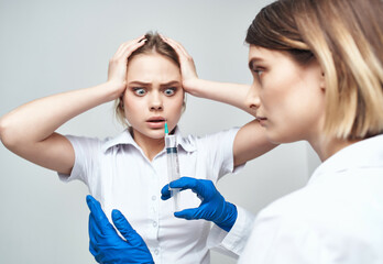 female doctor syringe in hand treatment isolated background