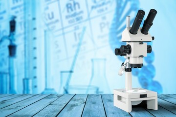 The classic white scientific microscope on the lab desk