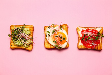Obraz na płótnie Canvas Different toasts with micro green on color background