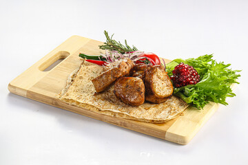 Pork tenderlion kebab over board