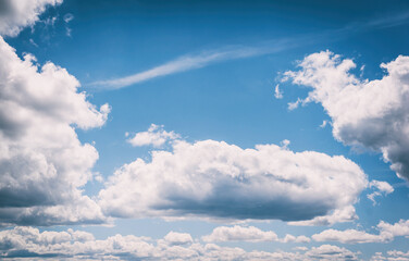 Obraz premium Blue sky with clouds. Summer Blue Sky and white cloud white background. Beautiful clear cloudy in sunlight calm season. Panoramic vivid cyan landscape in nature environment.