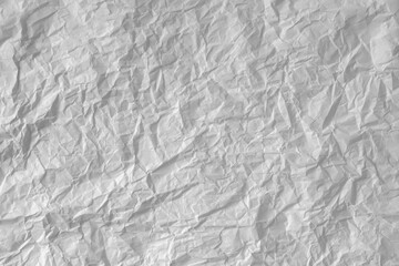 Crumpled white paper as background.