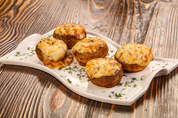 Baked champignon with cheese and herbs