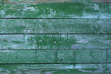 Old green shabby wooden board wall background