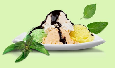 Homemade tasty sweet sorbet, ice cream in a white ceramic bowl with mint