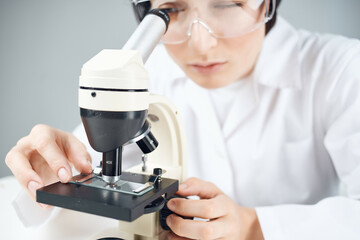 woman laboratory assistant microscope science professional analysis biotechnology