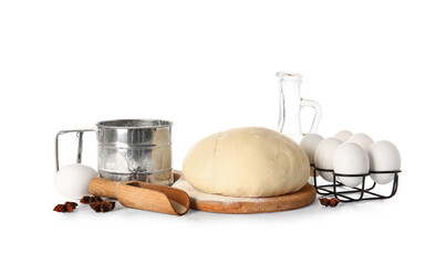 Wooden board with fresh dough, dry yeast and ingredients on white background