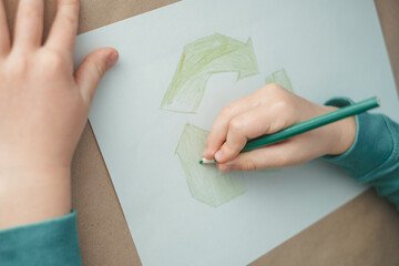 Children's hand drawing reuse symbol. top view. High quality photo