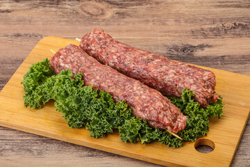 Raw minced beef kebab skewer