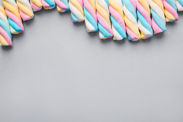 Composition with tasty marshmallows on grey background