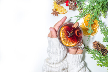 Mulled wine, traditional hot winter autumn alcohol boozy drink, with cinnamon, anise and orange, On Christmas decorated background copy space