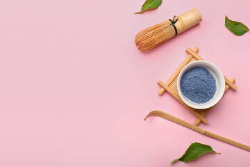 Composition with powdered blue matcha tea on color background