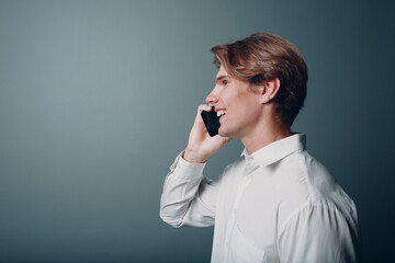 Portrait european young man portrait with mobile phone