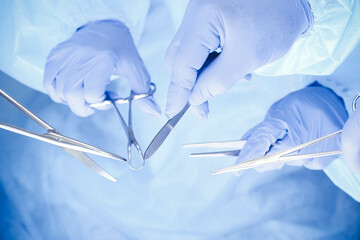 A group of surgeons is operating at the hospital, close-up of hands. Health care concept