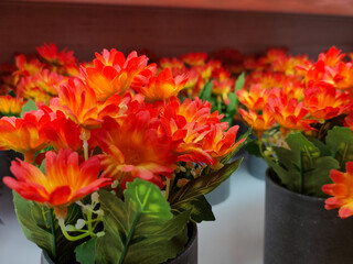 Orange plastic flower macro photo