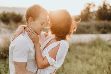 Young couple kissing and huging outdoors