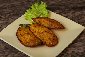 Baked potato with herbs and spices