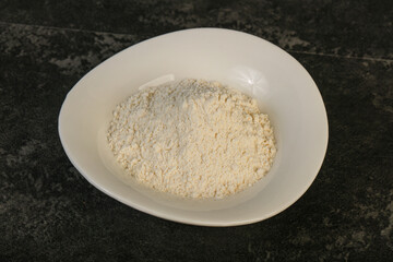 Wheat flour heap in the bowl