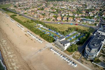 Aerial of Goring by Sea beach with Sailing Dinghies in view at the Yacht Club behind the beach huts.