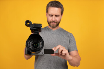 lens of camcorder held by man videographer making movie for vlog, selective focus, vlogging