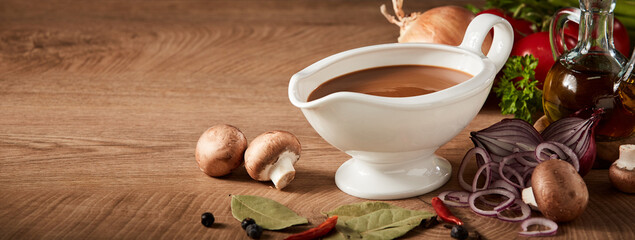 Sauce boat or sauciere filled with a rich brown gravy