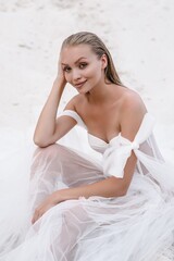 Naklejka premium Beautiful wedding bride day outdoors at ocean beach. Happy marriage couple o