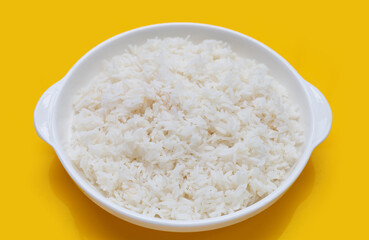 Fototapeta na wymiar Dish of rice on yellow background.