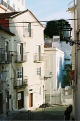 street in the city of Lisbon. Street to the castle of lisbon portugal. Sun in a small street of the old town in lisboa