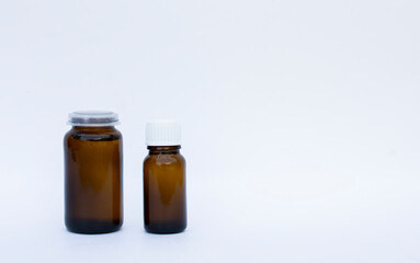 two brown bottles on white backgrounds with free copy space