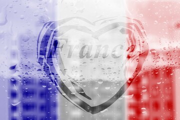 Handwritten word France in heart shape on misted window with raindrops and French flag