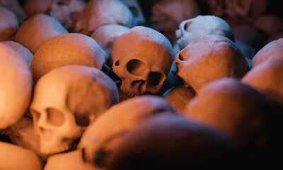 close up shot of a pile of skulls with selective focus and warm light. halloween concept. 3d rendering 