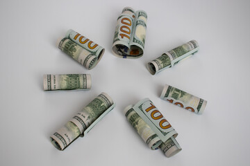 American 100 dollars in a shape of sun.