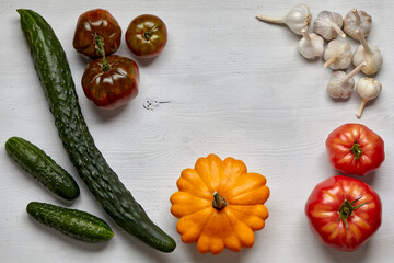 Frame of homegrown vegetables on a wooden table