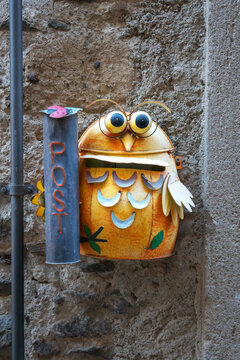 funny looking letter box on the wall