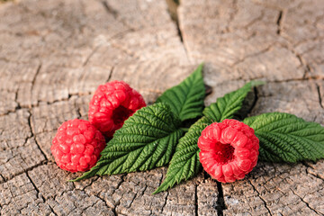 Heap of raspberries on natural wooden background. New fresh harvest, summer, summertime, garden...