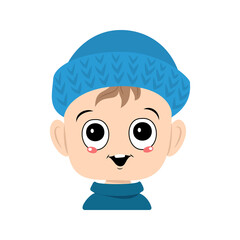 Avatar of a child with big eyes and a wide smile in a blue knitted hat. A cute kid with a joyful face in an autumnal or winter headdress. Head of adorable toddler with happy emotions