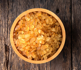 gravel sugar in wood bowl on table