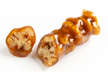 Walnuts on a string dipped in starch grape molasses. Churchkhela. Walnut sujuk.