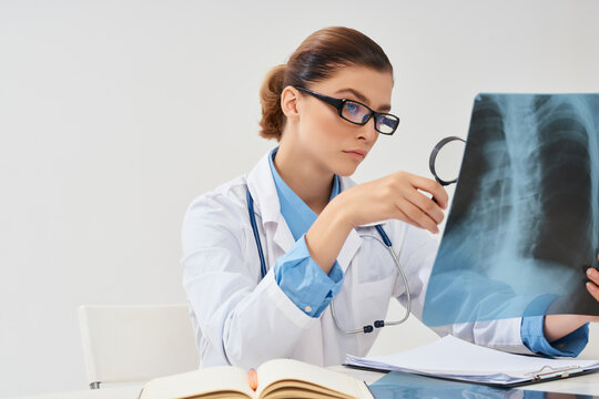 woman sitting at table x-ray treatment professional