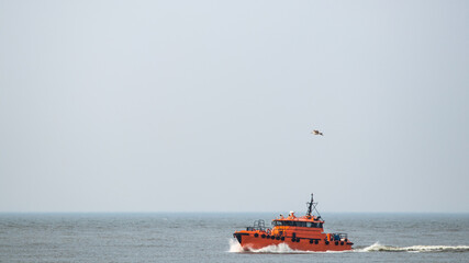 Pilot Boat crashing through waves in Baltic sea and returning to Klaipeda harbour.